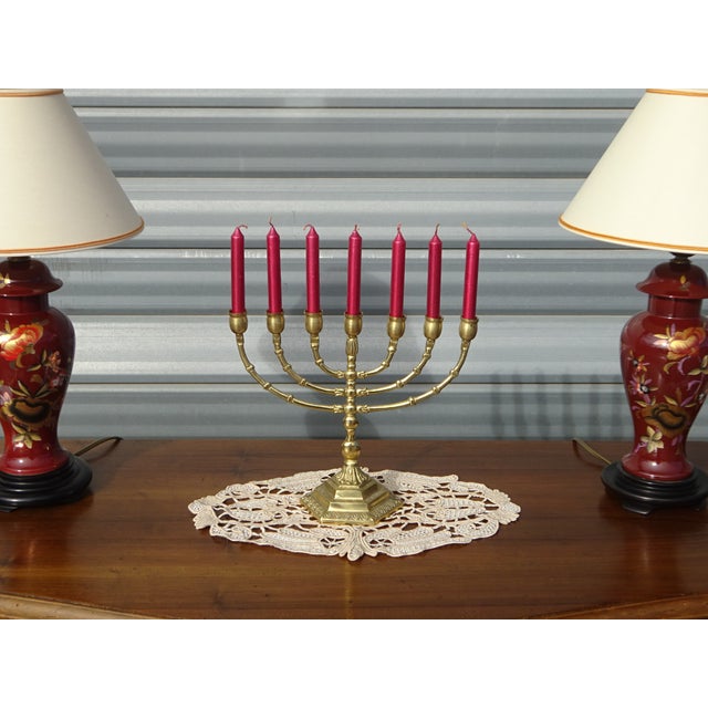 Beautiful 7-branch candelabra made entirely of gilded brass. 11 cm hexagonal base with delicate hand-crafted motifs....