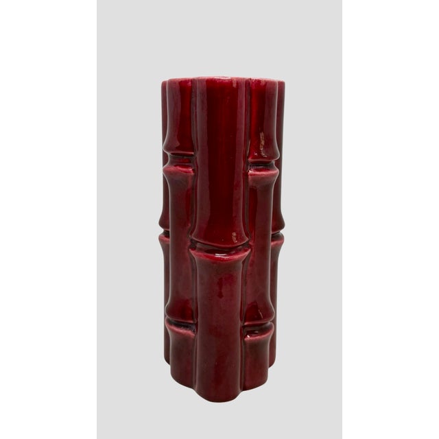 This Red Wing USA Burgundy Bamboo Stalk Ceramic Vase with a Light Grey interior is a stylish and unique decorative piece...