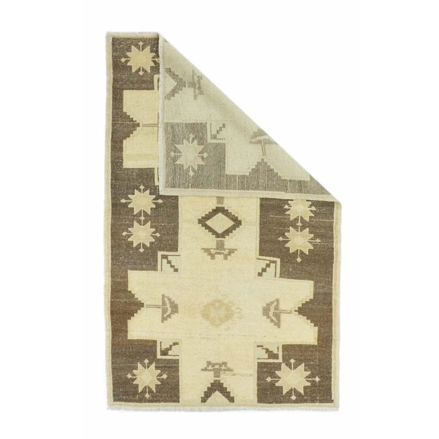 In a modified Caucasian style, with two giant conjoint “Lesghi stars” in straw on an abrashed rust-red field. String beige...