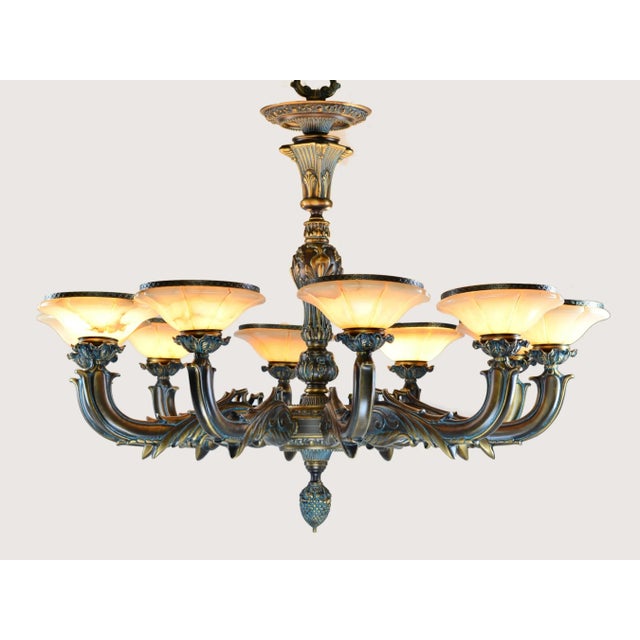 Elegant 10-arm solid bronze chandelier with genuine alabaster shades, made in Spain. Perfect for luxury dining rooms,...