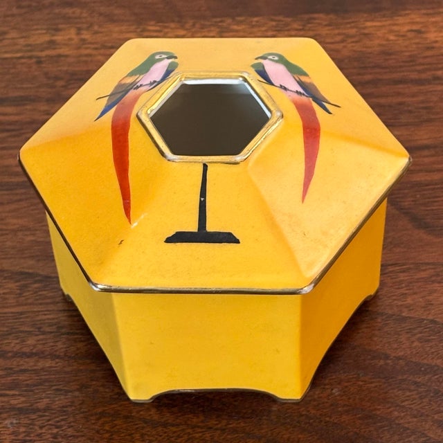 Antique Noritake hand-painted and gilded Japanese porcelain hair receiver dish and lid. Beautiful parrots flank the...