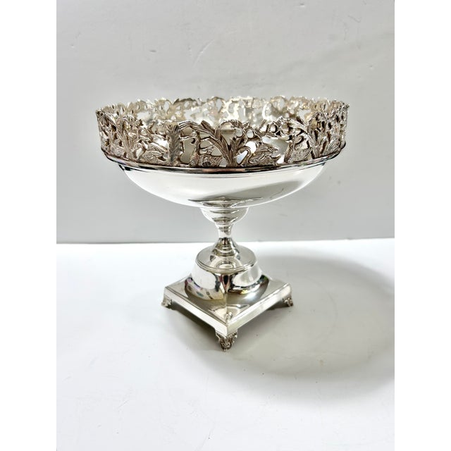 Graceful swans glide among cattails and reeds in the beautifully detailed pierced gallery of this vintage silverplate...
