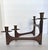Mid-20th century Danish candle holder with articulating arms in teak wood and brass. Holds four traditional size tapers in...