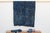 A masterwork of Malian textile heritage featuring deep indigo saturation and symbolic geometric motifs. Originating from...