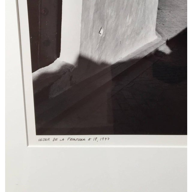 Framed and signed, black and white, 1970's, silver gelatin print by street photographer Jed Fielding. An internationally...