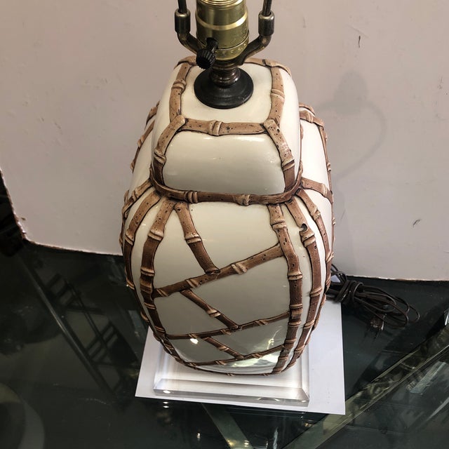 Beautiful heavy faux bamboo ceramic lamp on a lucite base has a label from Speer lamp company on its socket
