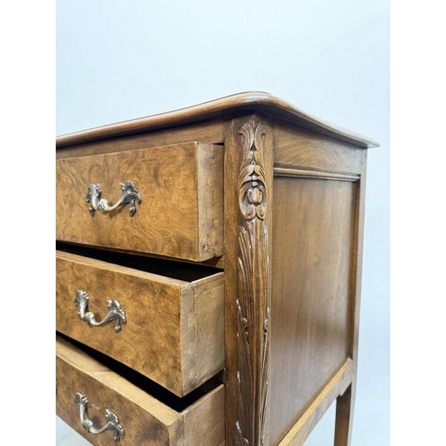 This exquisite early 20th-century French chest of drawers is a statement piece, featuring graceful cabriole legs and...