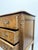This exquisite early 20th-century French chest of drawers is a statement piece, featuring graceful cabriole legs and...
