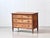 An elegant antique chest of drawers in a classicist style, stylistically belonging to the Directoire or early Biedermeier...
