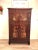 A vintage Asian scholar cabinet with a beautiful rich rosewood color. Highlighted by a traditional Asian landscape design...
