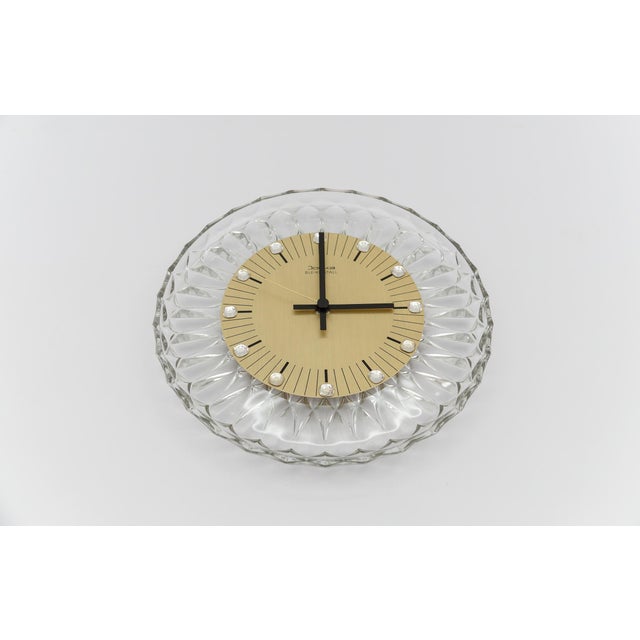 Elegant JOSKA Hollywood Regency wall clock made of lead crystal, 1970s Germany Powered by a standard AA battery. The clock...