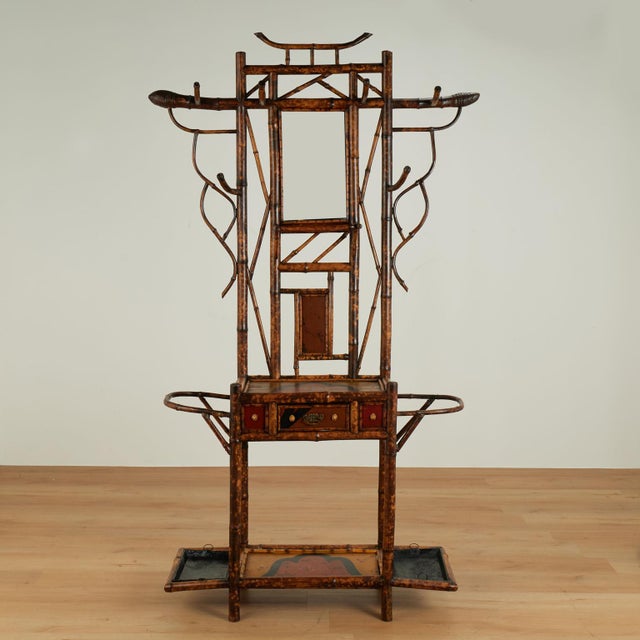 Impressive 19th century English hall tree handcrafted in burnt bamboo featuring a pagoda form top, bamboo roots, hat...