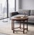 Circular coffee table crafted from solid stained oak, dating from the first half of the 20th century. The design is...