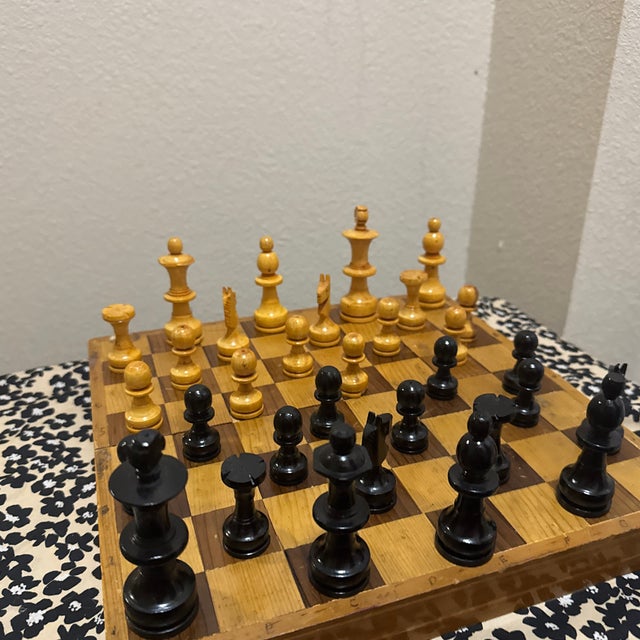 A collectible vintage wooden chess set originating from the Soviet era, dating to the 1960s. This set reflects the...