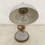 A small, original 1940s table lamp from England, made by Salar. Its all-metal structure combines brass for the trim and...