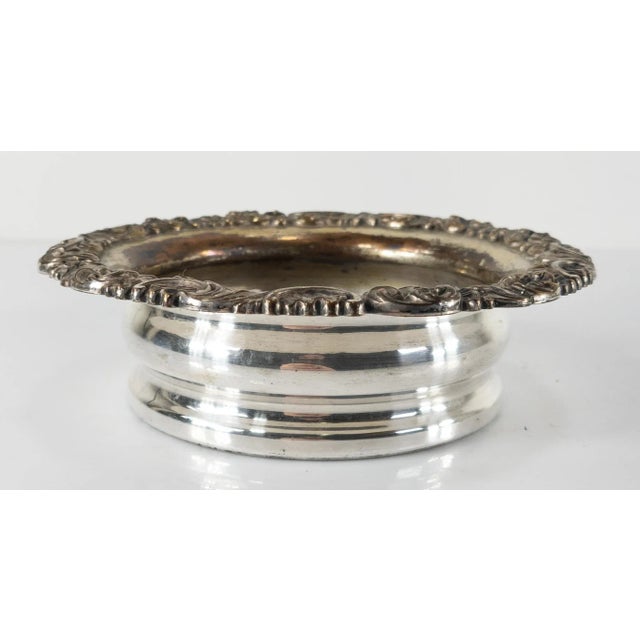 We are selling this English Sheffield silver plate on copper wine coaster with Victorian style, probably late 19th or...
