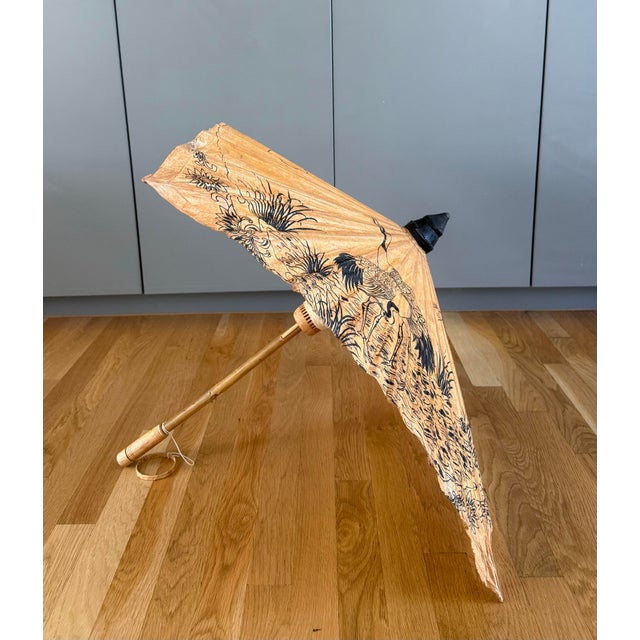 Vintage Japanese paper and bamboo hand painted parasol in an. unusual square shape. Constructed with a bamboo handle and...