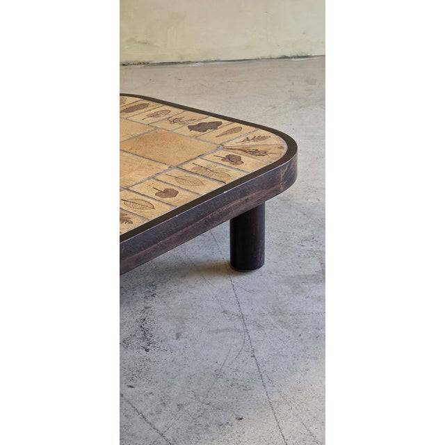 Roger Capron, coffee table, beech, mahogany, ceramic, France, 1960s This elegant French rectangular coffee table from the...