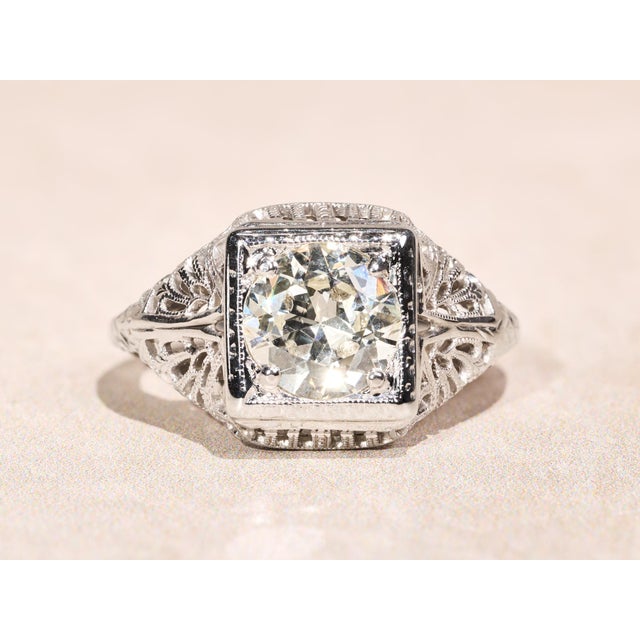 The Rebecca Ladies 18 Karat White Gold Filigree engagement ring set with 1.30 Carat European cut diamond. The diamond has...