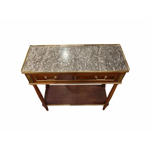 This elegant Louis XVI style console table brings classic French sophistication to any entryway, hallway, or living space....