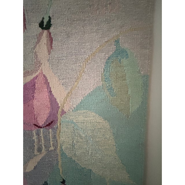 Large loom woven wall hanging tapestry from the 1970s depicting cascading deco stylized fushia plants. Woven in a very...