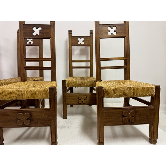 Set of Six Arts and Crafts Ecclesiastical Dining Chairs, circa 1920. A striking set of six Arts and Crafts dining chairs,...