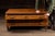 Low-profile oak flat file cabinet featuring a wide rectangular top over two full-width shallow drawers, originally...