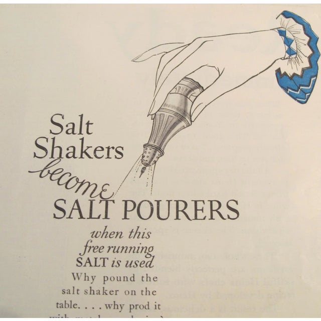 About The Poster: An elegant blue and white advertisement page for Morton's Salt company, "When it rains - it pours plain...