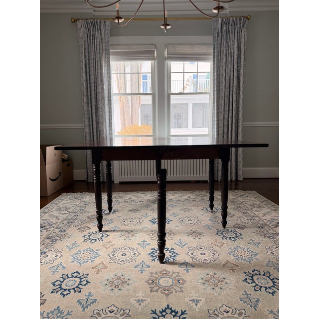 Antique drop-leaf dining table with turned legs, handcrafted in eastern North Carolina circa 1800. Versatile and...