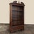 Antique French Henri II Neoclassical Open Bookcase represents a tailored expression of the neoclassical revival style that...