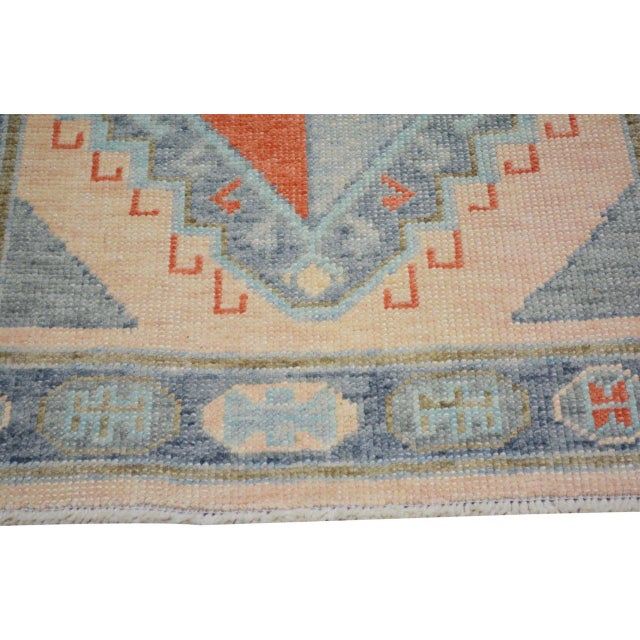 Hand-knotted with care using traditional rug-making techniques, this wool rug blends timeless craftsmanship with a modern...
