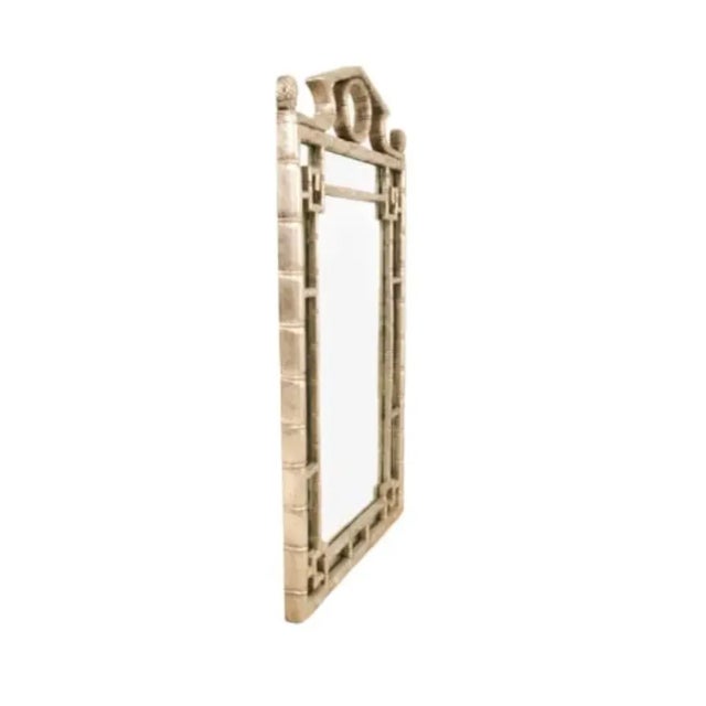 This stunning Chinese Chippendale-style mirror embodies the perfect blend of exotic elegance and classic refinement....