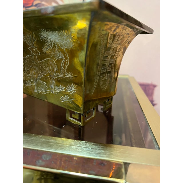 The Greek Key Footed Brass Planter exudes timeless sophistication, blending classical design with a touch of opulence,...