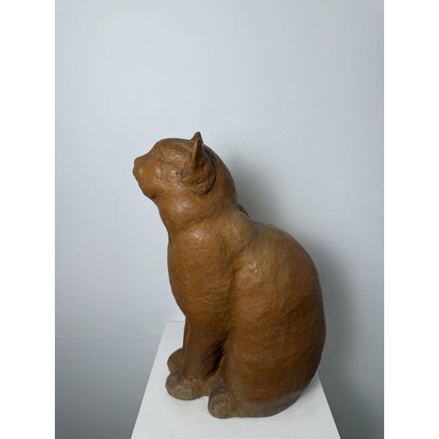 19th-century terracotta sculpture of a seated cat. Montelupo Fiorentino (Tuscany). This artistic sculpture features an...