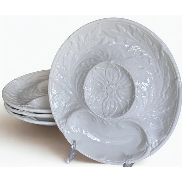 In French white majolica, here is a set of four vintage aritichoke plates for your next gathering. Ideally used for...