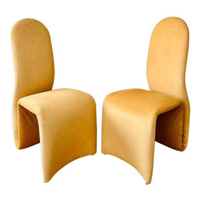 Original pair of Etcetera high back armchairs attributed to Jan Ekselius with his signature curved seat and back are newly...