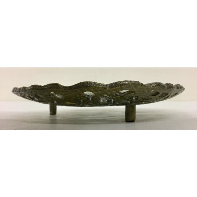 A very unusual little glass covered Trinket Dish. Sits on 3 legs and has a nice concave glass on the surface of the carved...