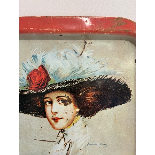 This vintage 1973 Coca-Cola metal serving tray features the beloved Hamilton King "Coca-Cola Girl" illustration,...