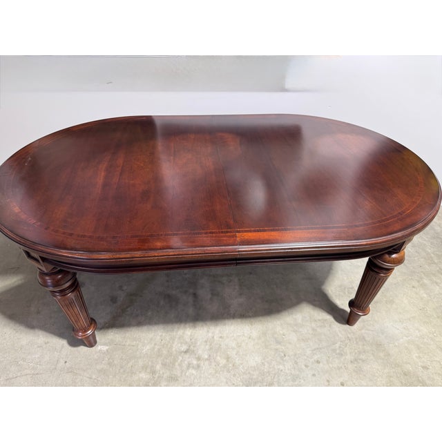Thomasville Oval dining table with 4 legs. 76" without leafs plus two 20" extension leafs opens to 116". Mahogany finish...