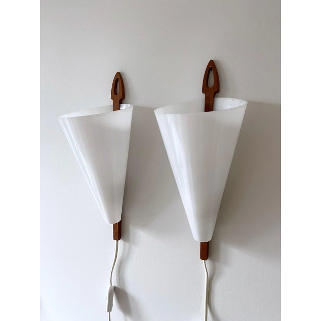 Pair of Wall lamps by iconic Swedish Mid-Century lamp designer Hans-Agne Jakobsson for him eponyms brand in Markaryd,...