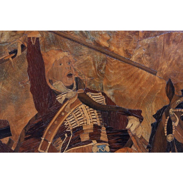 A very beautiful and large parquetry panel (inlaid wood) depicting soldiers on horses. Our best guess is that the scene...