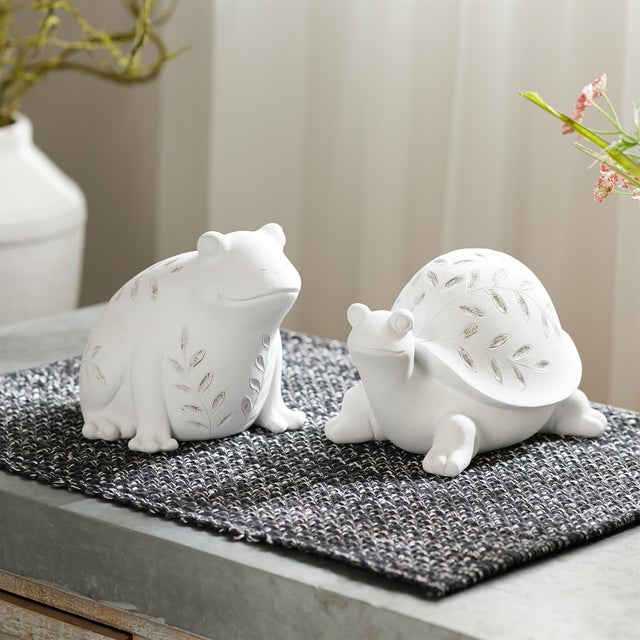 Bring a touch of whimsy and nature-inspired elegance to your space with this set of two Etched Frog and Turtle Figurines....