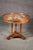 This Russian Baltic Empire style occasional table is a striking example of neoclassical refinement, crafted with timeless...