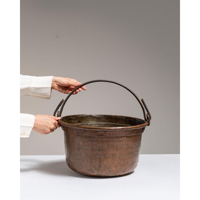 This 19th century serving piece from Belgium is finished in chocolate, worked in copper. Its form follows honest, well-...