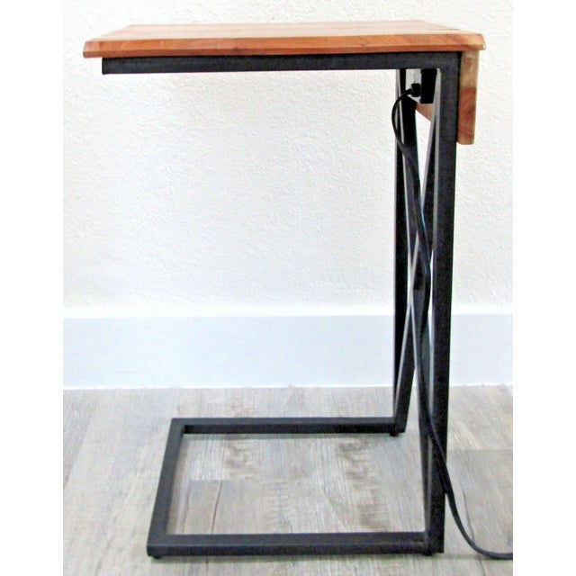 Live Edge Acacia Wood Side Table with Black Iron Frame - Electrical and USB Outlets Manufactured by Modus. The solution to...