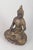 Gilt bronze Buddha figure. Seated Buddha figure executed in gilt bronze with a meditative pose, detailed ornamental...