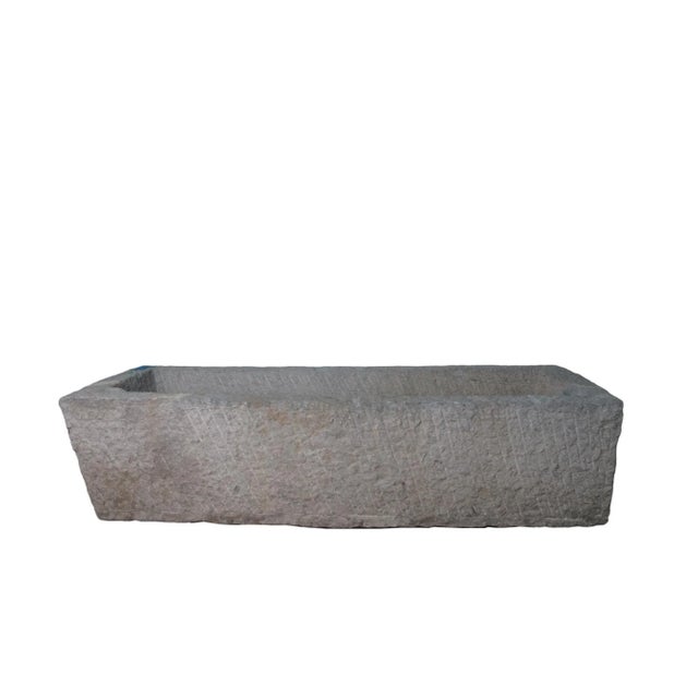 This stone trough is hand carved out one piece of stone and hand chiseled by the locals. This hand made stone planter is...