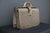 This highly original Louis Vuitton pilot or doctor's bag features monogrammed canvas and a stamped solid brass Louis...