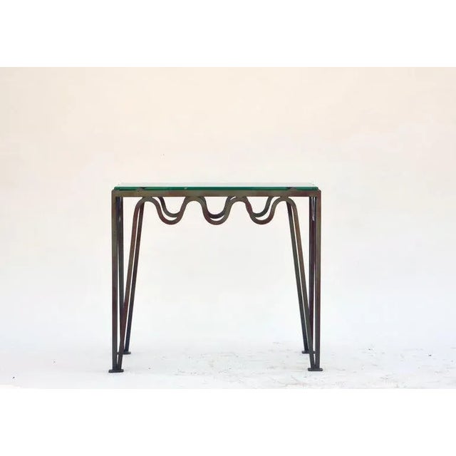 Undulating verdigris iron and glass side table by Design Frères. Great as a pair of sofa end tables, a 2 part-coffee...