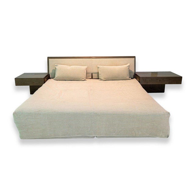 An elegant king size bed frame by Giovanni Offredi for Saporiti. Showcasing a fabric headboard with sleek lacquered wood...